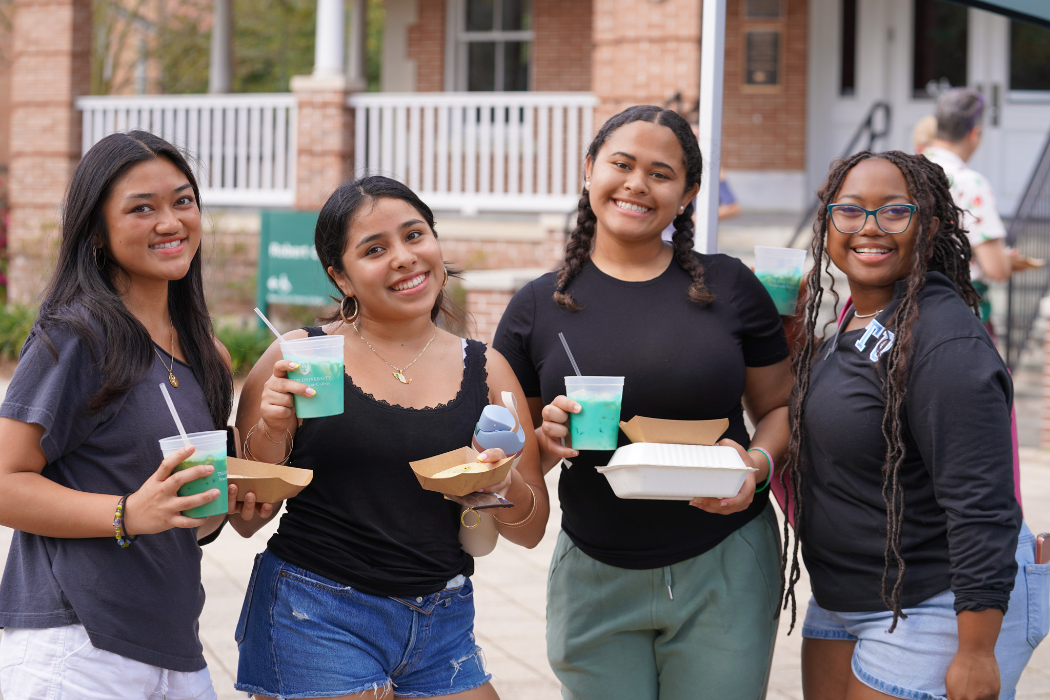 Four students outside Cudd Hall for Front Porch Friday